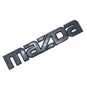 Эмблема надпись MAZDA ЧЕРНАЯ 143х27мм пластик на скотче (логотип, значок, шильдик) (пр-во Завод) СН